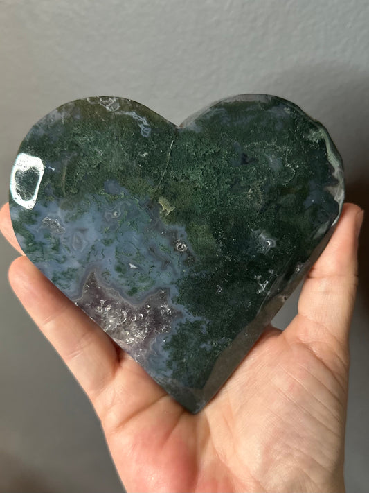 Moss Agate With Amethyst Druzy Inclusions Crystal Heart Carving On Display Stand