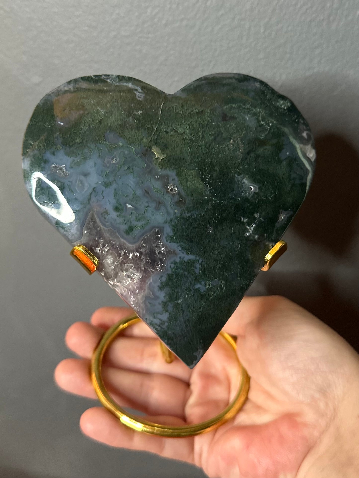 Moss Agate With Amethyst Druzy Inclusions Crystal Heart Carving On Display Stand